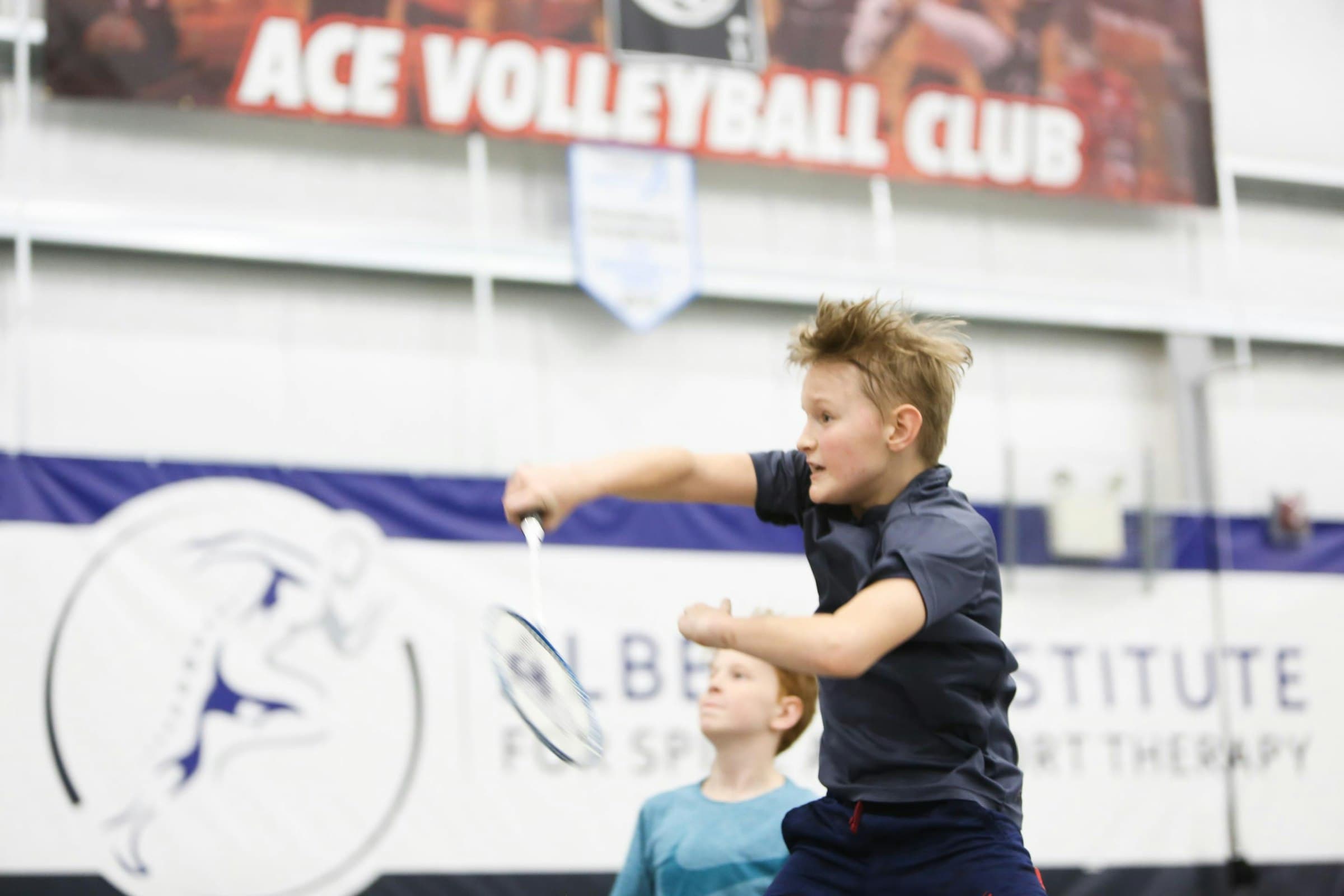 A young player mid-swing during a training session